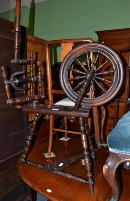 Lot 604 - A turned fruit wood spinning wheel