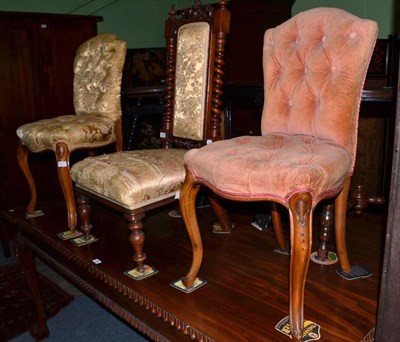 Lot 607 - A Victorian walnut nursing chair and a pair of Victorian button back salon chairs