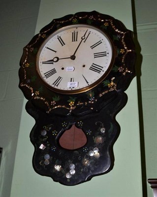 Lot 617 - A papier-mache and mother-of-pearl inlaid striking wall clock