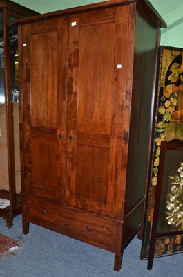 Lot 622 - A modern teak double door wardrobe