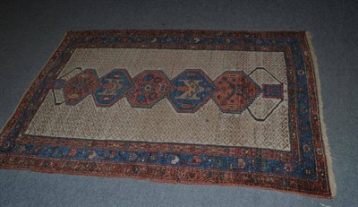 Lot 627 - Hamadan rug, Persian Kurdistan, the ivory diamond lattice field with a column of polychrome stepped