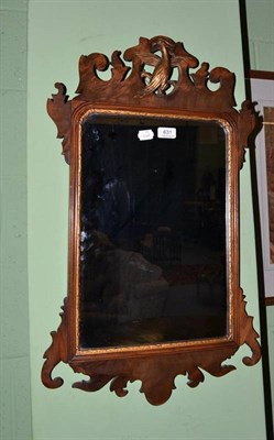 Lot 631 - A Georgian style mahogany fret carved wall mirror