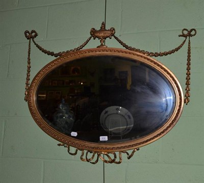 Lot 632 - An Edwardian oval wall mirror in a gilt gesso Neo-classical frame