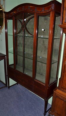 Lot 636 - An Edwardian mahogany glazed display cabinet with husk swag decoration