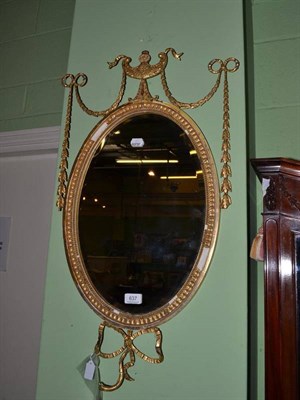 Lot 637 - An Edwardian Neo-classical style wall mirror in a gilt gesso frame