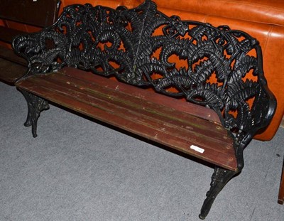 Lot 751 - A fern cast iron garden bench with slatted wooden seat