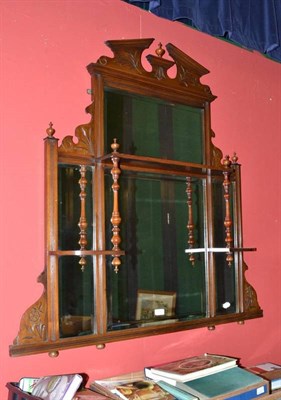 Lot 756 - A Victorian walnut over mantel mirror with open shelves