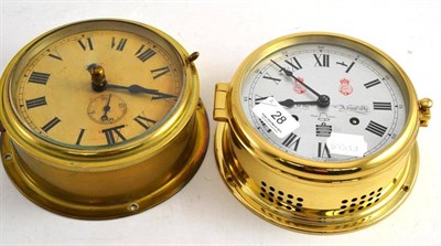 Lot 28 - Brass circular dial wall clock and a modern example (2)
