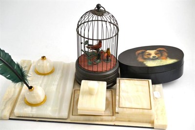 Lot 30 - Modern onyx mounted blotter and desk set, oval box and cover painted with dogs head (2)