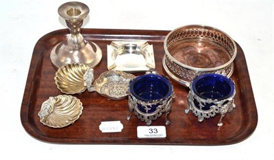 Lot 33 - Silver mounted pierced bottle coaster, two silver square ashtrays, two silver shell dishes, pair of
