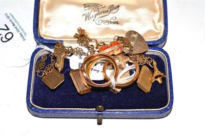 Lot 62 - An 18ct gold band ring, an 18ct gold signet ring, a 9ct gold ring, a 9ct gold charm bracelet...