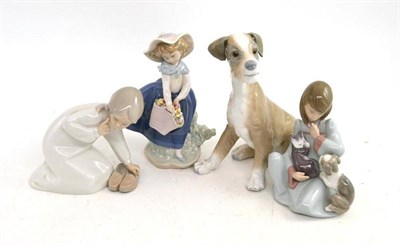 Lot 131 - Lladro figure of a dog and three other figures