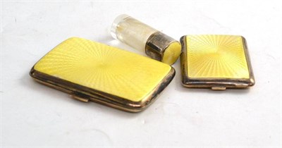 Lot 163 - An enamel and silver match case, a cigarette case and scent bottle (3)