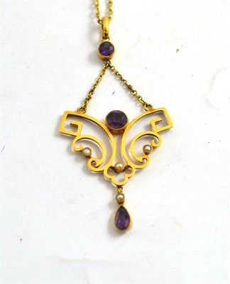 Lot 170 - An Edwardian amethyst and seed pearl pendant stamped '9ct' on chain