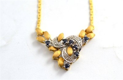 Lot 188 - A pendant set with sapphires and diamonds stamped '800' on a yellow metal chain stamped '750'