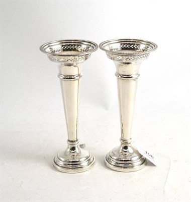 Lot 198 - A pair of loaded silver vases