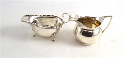 Lot 200 - A silver jug and a silver sauce boat