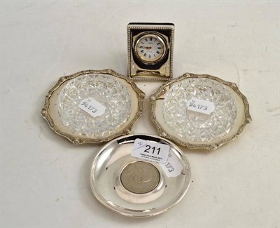 Lot 211 - Two silver and glass butter dishes, a Churchill crown set dish and a silver faced travel clock