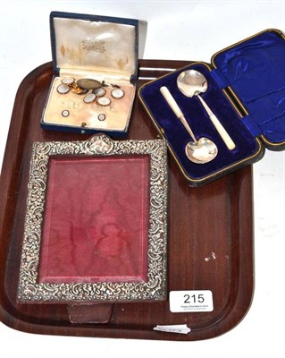 Lot 215 - A cased set of dress studs, a silver 'dog tag', a cased pair of caddy spoons and a photograph frame