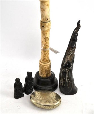 Lot 223 - Chinese carved horn, bone candlestick,  two netsukes and a snuff box