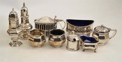 Lot 234 - A four piece silver cruet, two salts, two mustard pots and a pepperette (9)