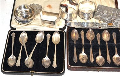 Lot 249 - A silver snuff box, a paper knife, four napkin rings, a wine taster and a set of two cased...