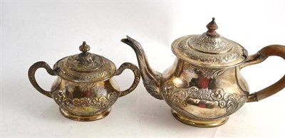 Lot 267 - A silvered metal teapot and sugar bowl