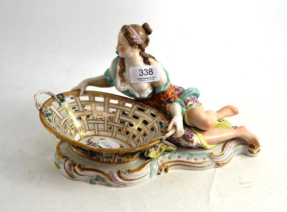 Lot 338 - Late 19th century Dresden china figure of a lady with basket (a.f.)