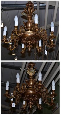 Lot 680 - A pair of gilt brass chandeliers