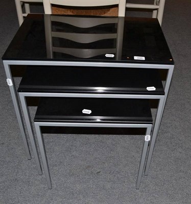 Lot 696 - A nest of three modern occasional tables