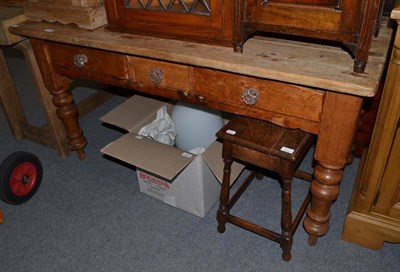 Lot 702 - A butcher's block and a pine kitchen table
