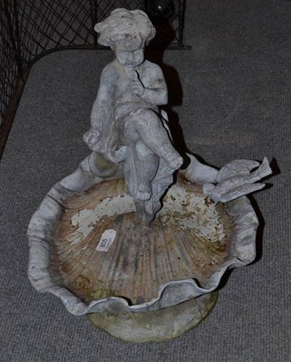 Lot 805 - A lead bird bath with a seated cherub