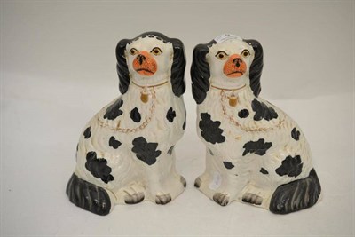 Lot 9 - A pair of Victorian Staffordshire pottery figures of spaniels