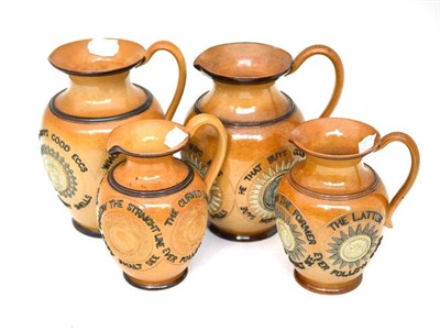 Lot 37 - A Doulton Lambeth motto jug sprigged with ";Who buys good ale buys nothing else"; and three similar