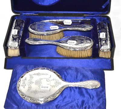 Lot 44 - A silver backed dressing table set, cased
