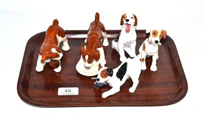 Lot 49 - Three Royal Doulton terriers, HN1159, HN1099, HN2654 and two Beswick puppies (5)