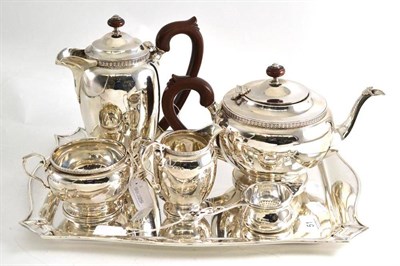 Lot 51 - A silver tea set on tray comprising teapot, water jug, sugar bowl, milk jug, strainer