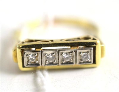 Lot 77 - An 18ct gold four stone diamond ring