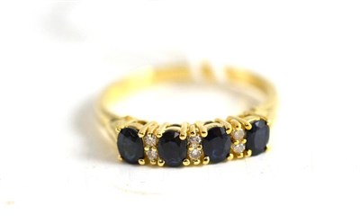 Lot 78 - A sapphire and diamond ring stamped '9K'