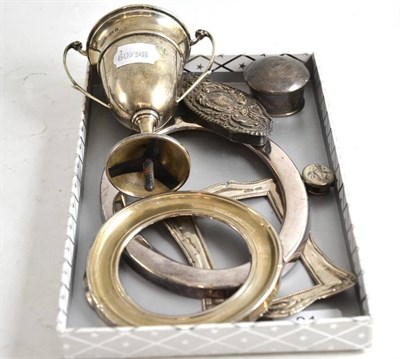 Lot 81 - A small silver cup, silver picture frame mounts, etc