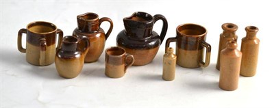 Lot 89 - Two miniature Doulton stoneware tygs, three jugs, a mug and four miniature bottles (10)