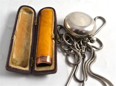 Lot 100 - A silver sovereign case and an amber cigar holder