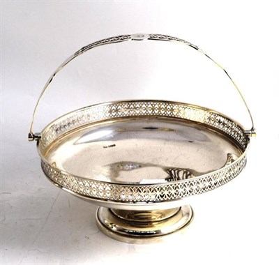 Lot 106 - A silver basket raised on a spreading foot with pierced rim and swing handle