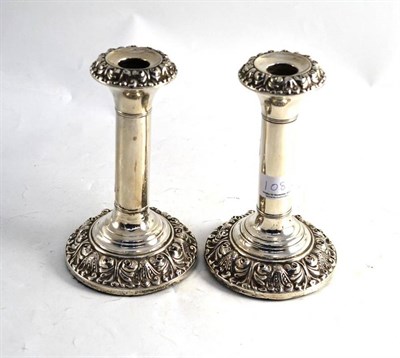 Lot 108 - A pair of loaded candlesticks