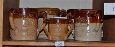 Lot 120 - Four Doulton stoneware tygs in various sizes and a double handled stoneware loving cup, impressed G