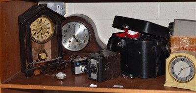 Lot 129 - An Olympus OM-1 camera in case, camera assortments, two mantel clocks, nickel plated pocket...