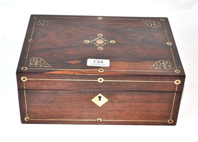 Lot 134 - A rosewood inlaid hinged work box with mother-of-pearl mounted bobbins, bodkins, miniature doll etc