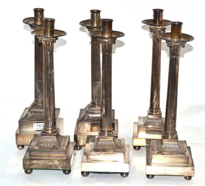 Lot 141 - A pair of plated ecclesiastical style candlesticks and four others