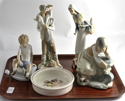 Lot 152 - Two Lladro figures, two Nao figures and a Peter Rabbit bowl