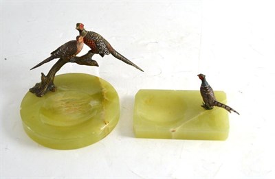 Lot 162 - Cold painted brace of pheasants on an onyx ashtray and a single pheasant ashtray (2)